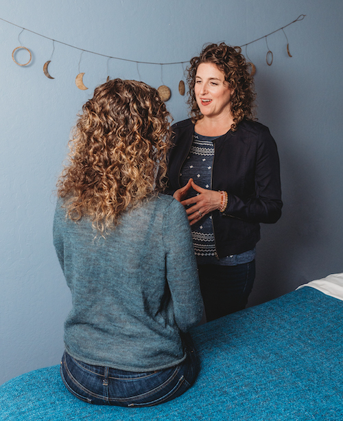 Marie Bowser standing by a tree - Acupuncture and Chinese Medicine for women's health, stress and emotional health in Albany and El Cerrito, CA with licensed acupuncturist Marie Bowser.